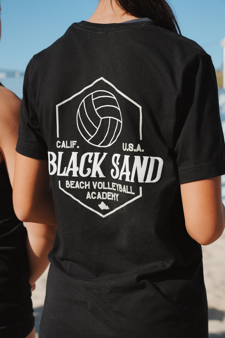 Back of a beach volleyball academy team shirt with badge logo